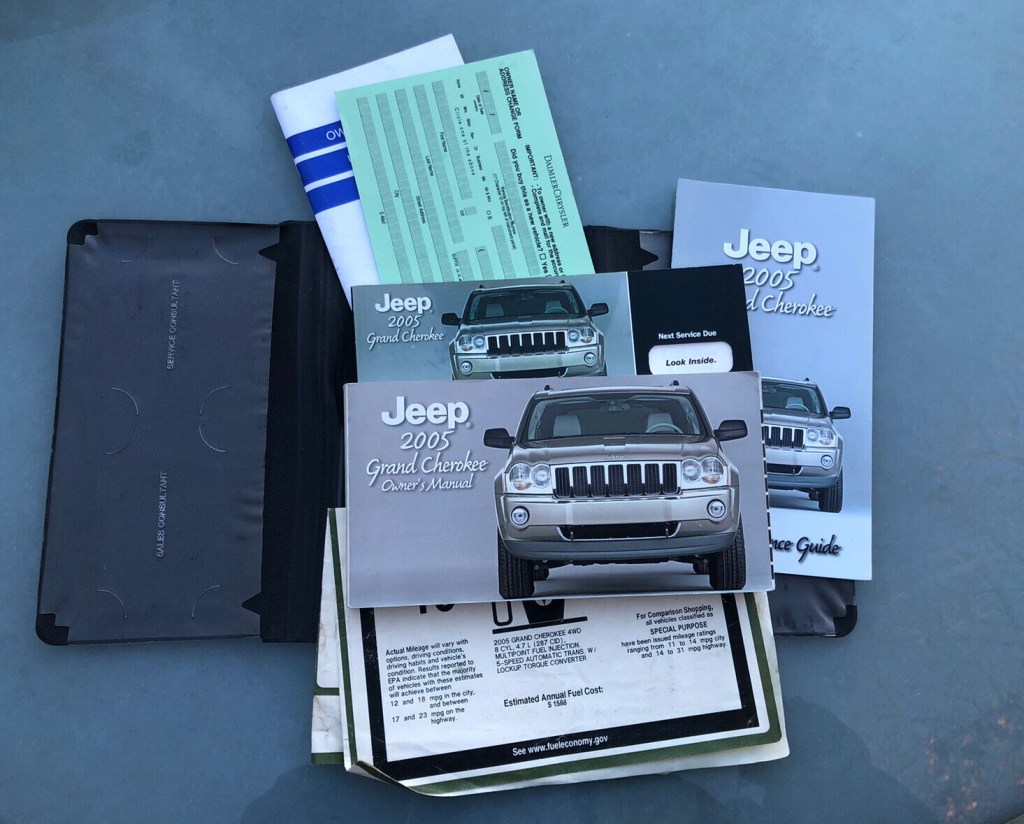 Picture of: Jeep Grand Cherokee owners manual with cover case  eBay